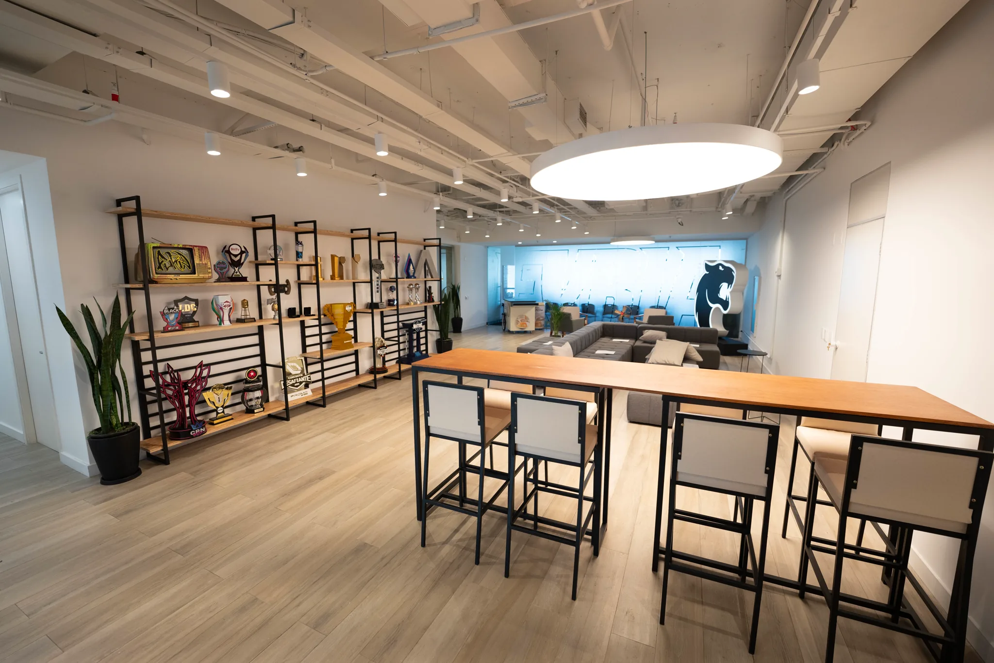 FURIA new office in São Paulo, with a lounge area and trophies